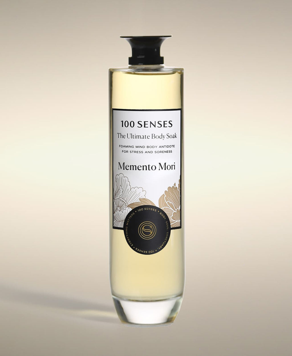 Memento Mori Ultimate Body Soak in a thick-bottomed glass bottle with botanical label artwork.