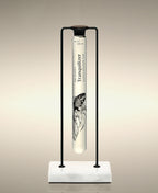 Tranquilizer glass Cylinder Soak displayed in the Single Cylinder Soak Stand in black-and-marble.