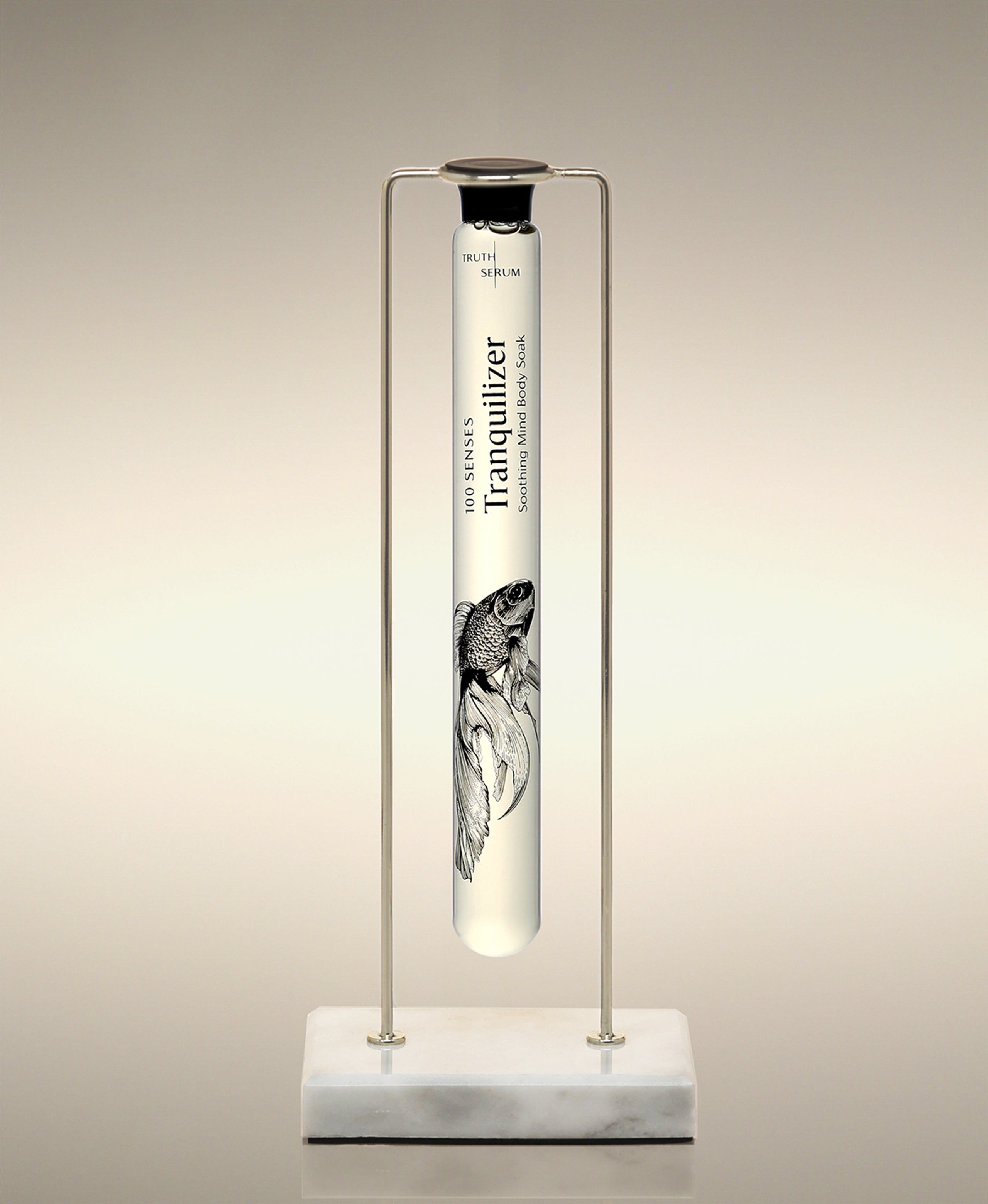 Tranquilizer glass Cylinder Soak displayed in the Single Cylinder Soak Stand in gold-and-marble.