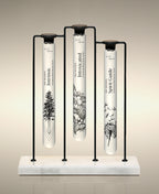 Intrinsic, Intoxicated and Spirit Guide  glass Foaming Cylinder Soaks displayed in the Trio Cylinder Soak Stand in black-and-marble.