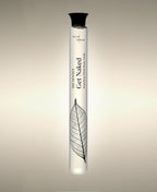 Get Naked Fresh Roses glass Faoming Cylinder Soak with veined leaf illustration, standing against a warm neutral background.