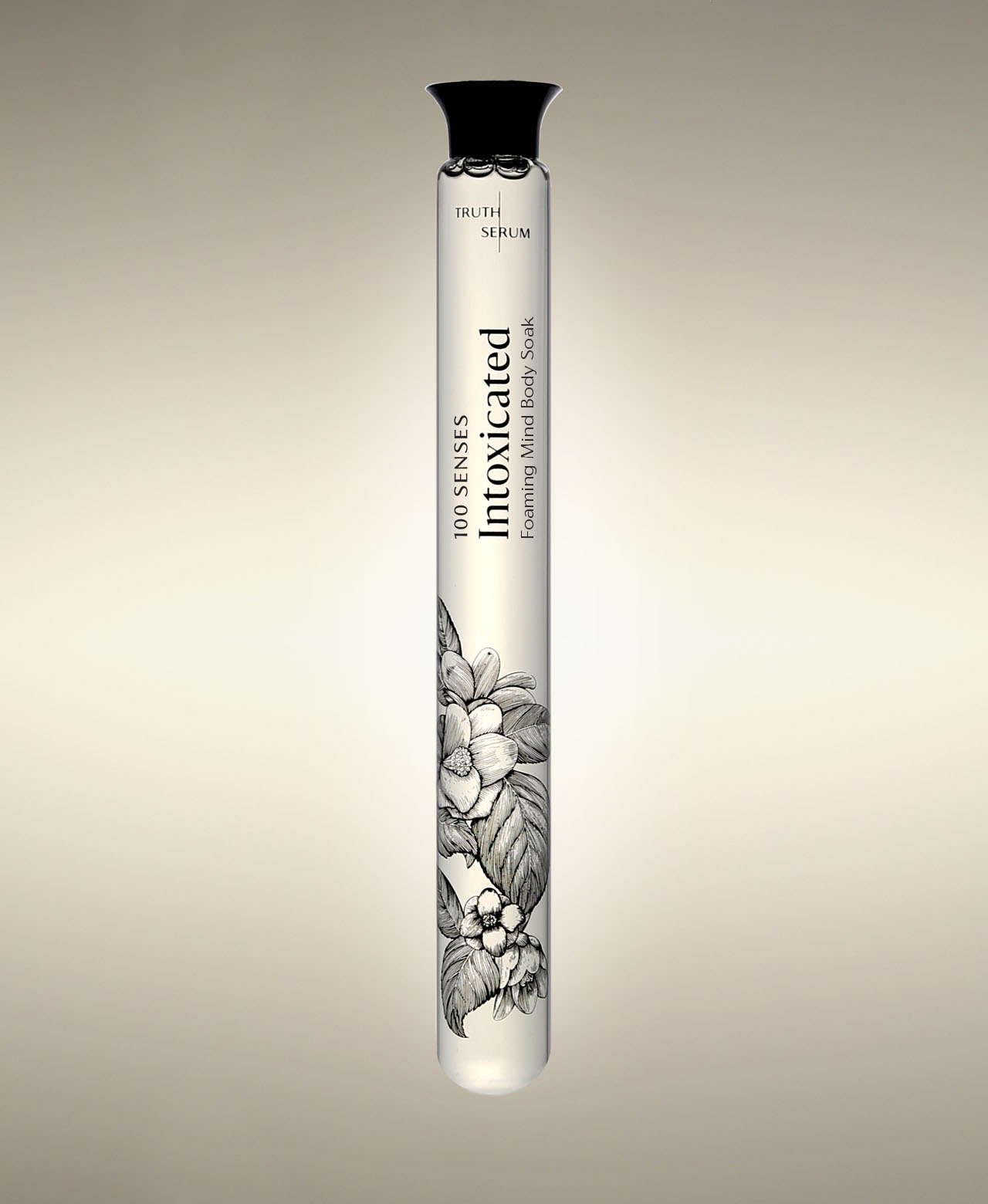 Intoxicated Foaming Bath Soak glass cylinder with a floral illustration, standing against a warm neutral background.