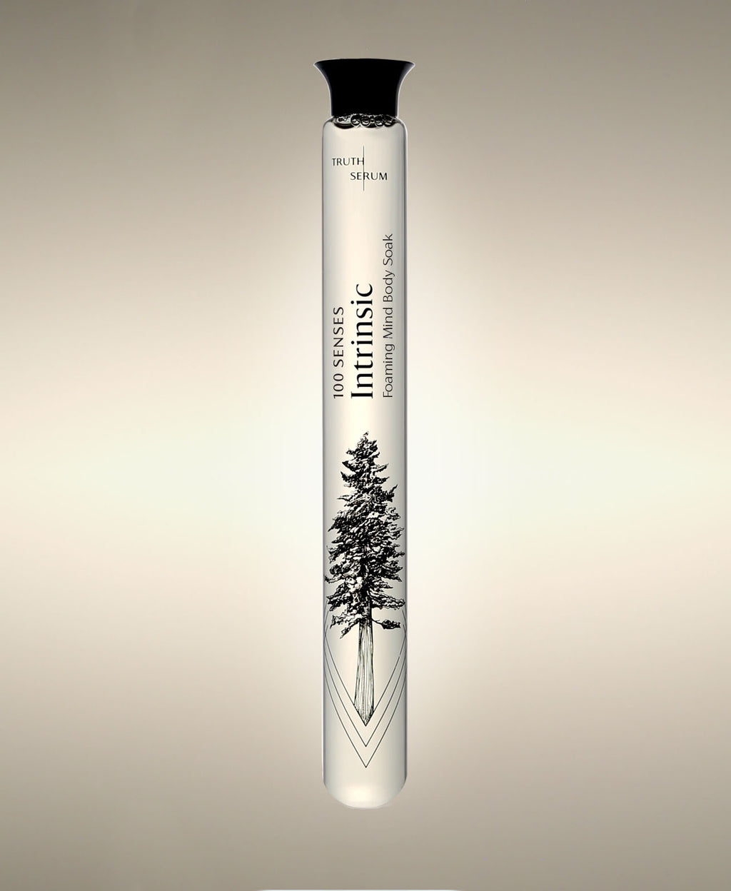 Intrinsic Green Tea glass Foaming Cylinder Soak with evergreen tree illustration, standing against a warm neutral background.