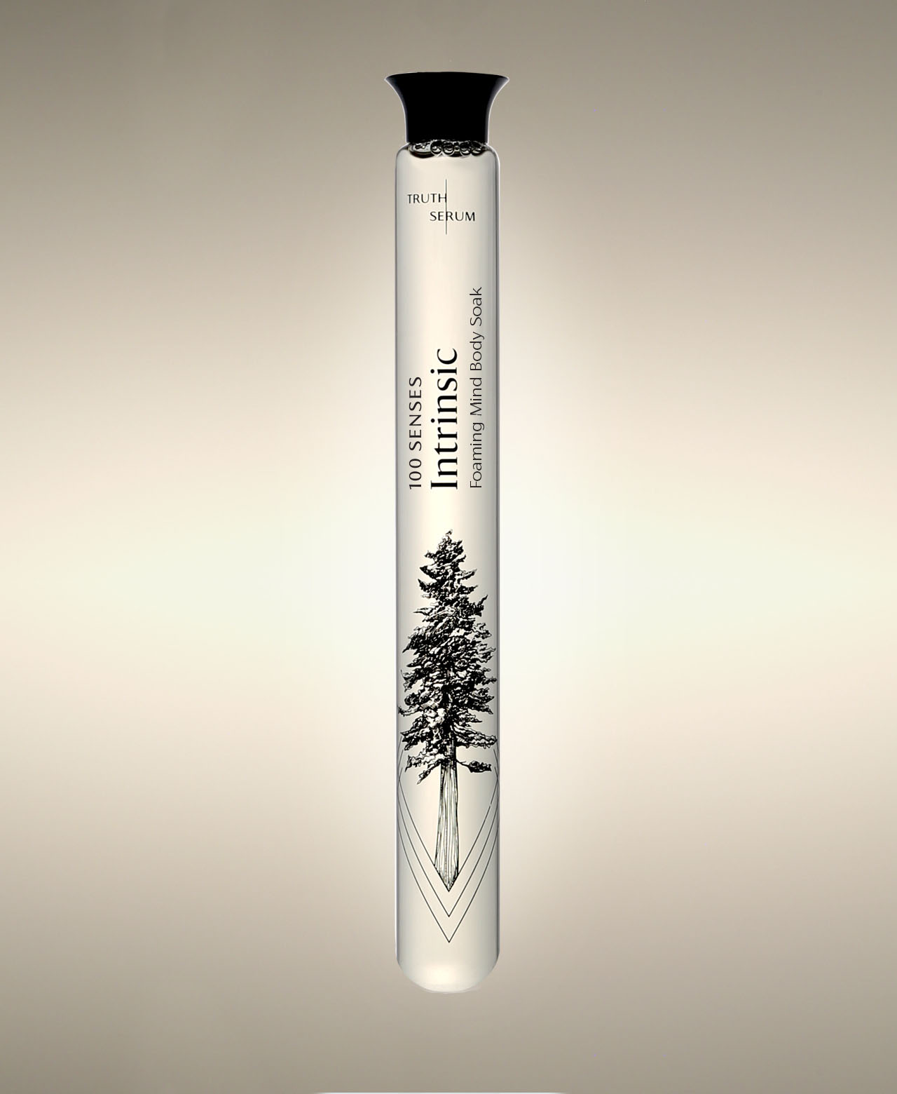 Intrinsic Green Tea glass Foaming Cylinder Soak with evergreen tree illustration, standing against a warm neutral background.