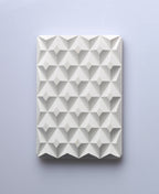 Natural white 3D Pyramid Body Bar Rest with a faceted pyramid pattern.
