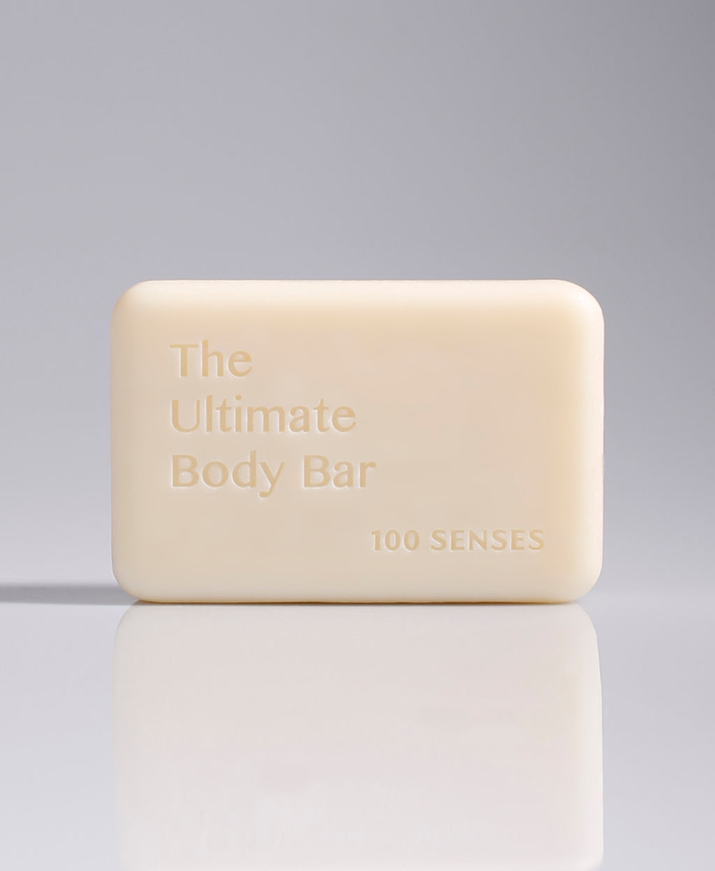 The Ultimate Body Bar standing upright against a pale gray gradient background.