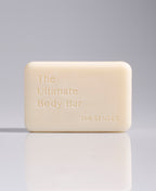 The Ultimate Body Bar standing upright against a pale gray gradient background.