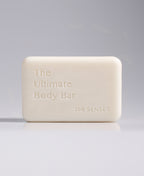 The Ultimate Body Bar standing upright against a pale gray gradient background.