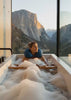 Woman relaxing in bath with Head Floater