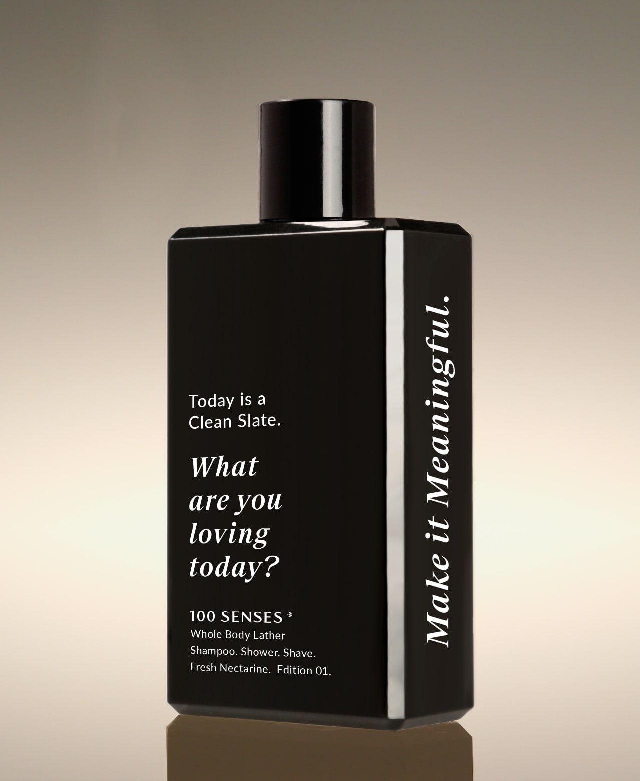Fresh Nectarine Clean Slate Body Lather bottle angled to show “What are you loving today?” on the front and “Make it Meaningful” on the side.