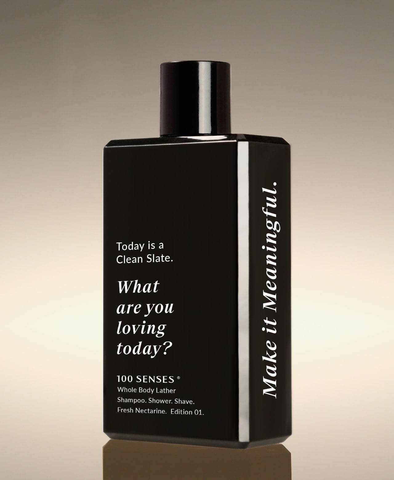 Fresh Nectarine Clean Slate Body Lather bottle angled to show “What are you loving today?” on the front and “Make it Meaningful” on the side.