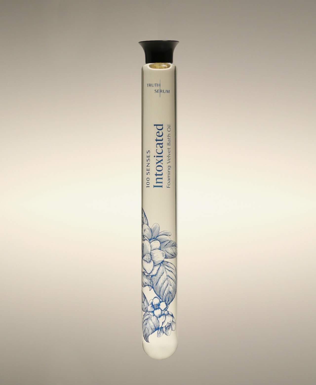 Intoxicated White Tuberose Soothing Cylinder Bath Oil glass cylinder with floral line-art illustration.