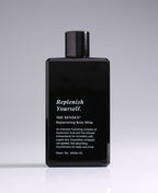Replenish Yourself Body Whip bottle standing against a pale gradient gray background.