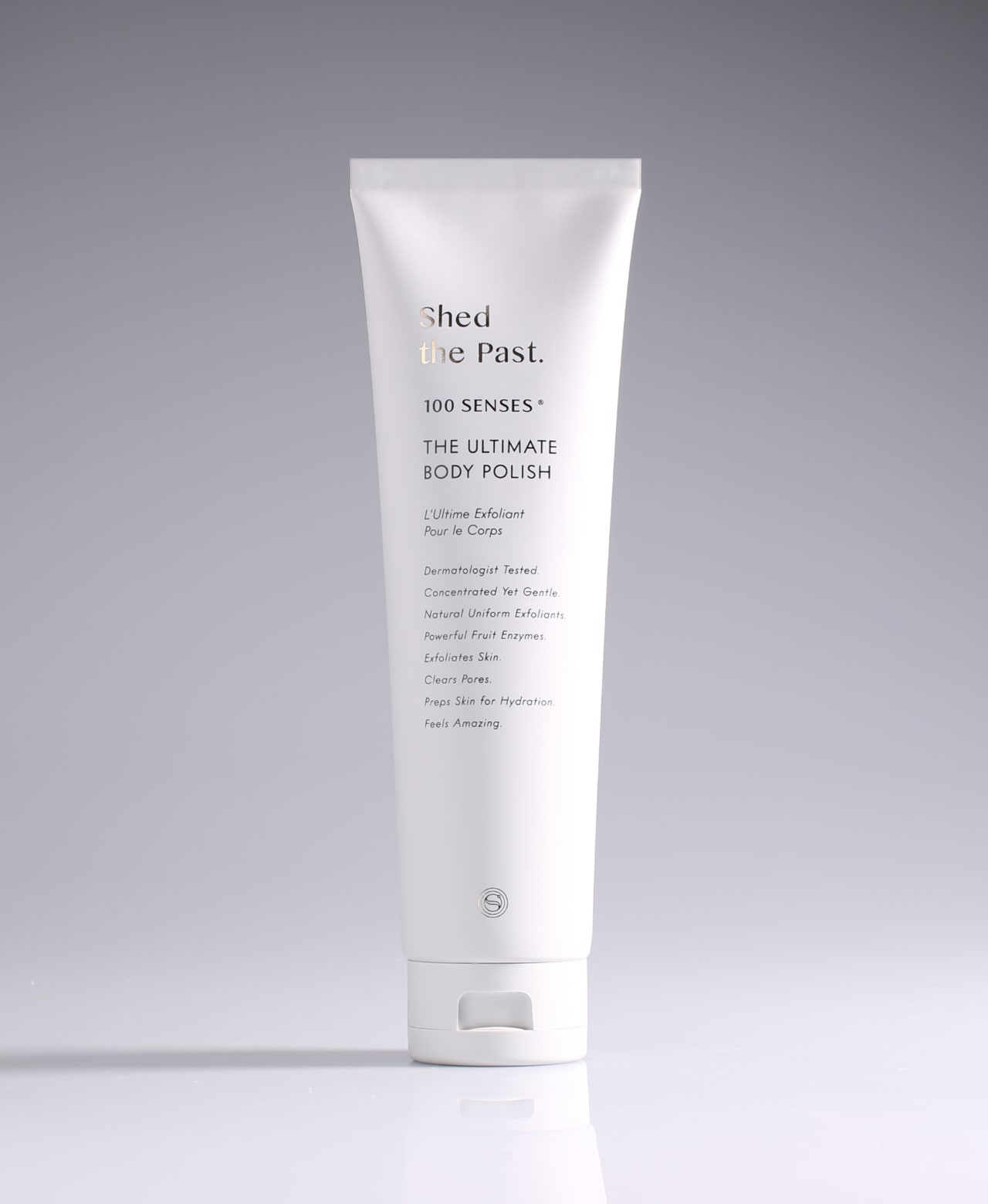 Shed the Past Ultimate Body Polish tube standing against a pale gradient gray background.