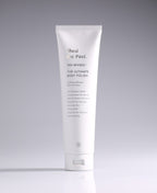 Shed the Past Ultimate Body Polish tube standing against a pale gradient gray background.
