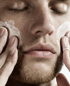 Person massaging Face Forward Ultimate Face Polish over their cheeks.
