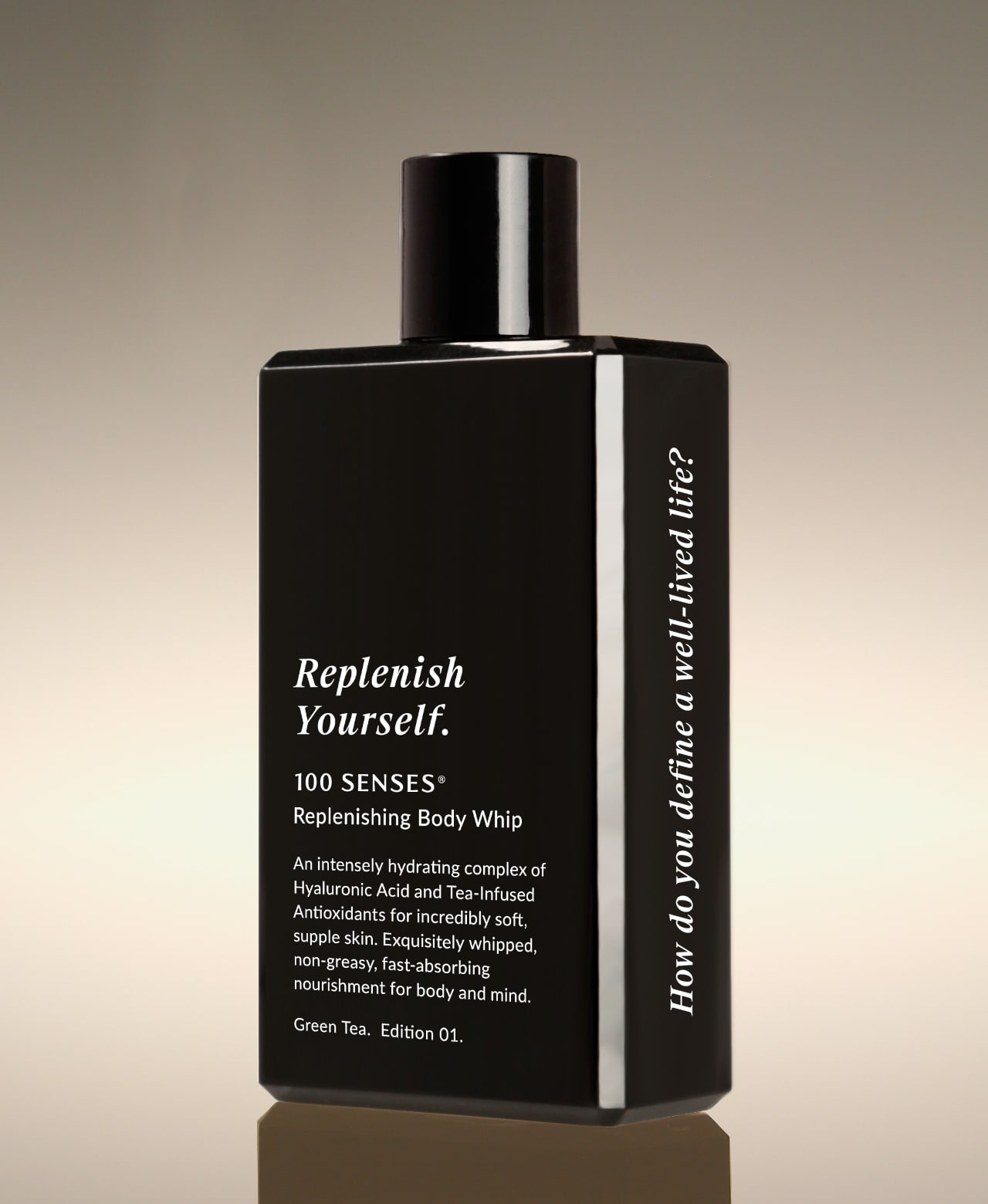 Green Tea Replenish Yourself Body Whip bottle angled to show “How do you define a well-lived life?” along the side.