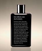 Back view of the Neroli Tea Replenish Yourself Body Whip bottle, with a reflection beginning “Go where you feel whole.”