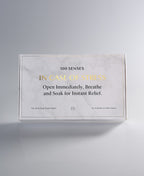 Closed Mind/Body Soak Sampler box reading “IN CASE OF STRESS: Open Immediately, Breathe, and Soak for Instant Relief.”