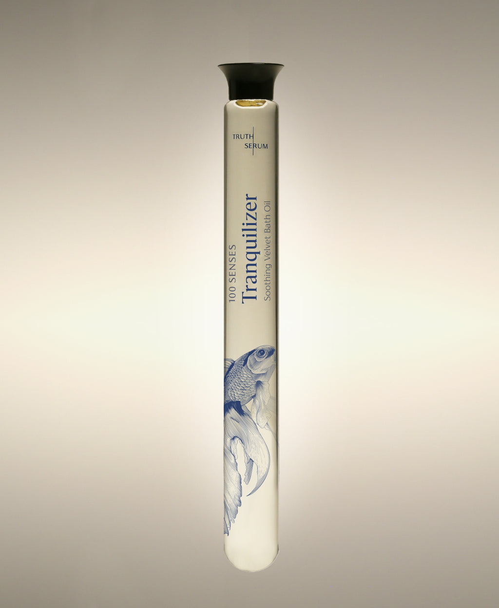 Tranquilizer Cylinder Bath Oil glass bottle with a betta fish illustration, standing against a warm neutral background.