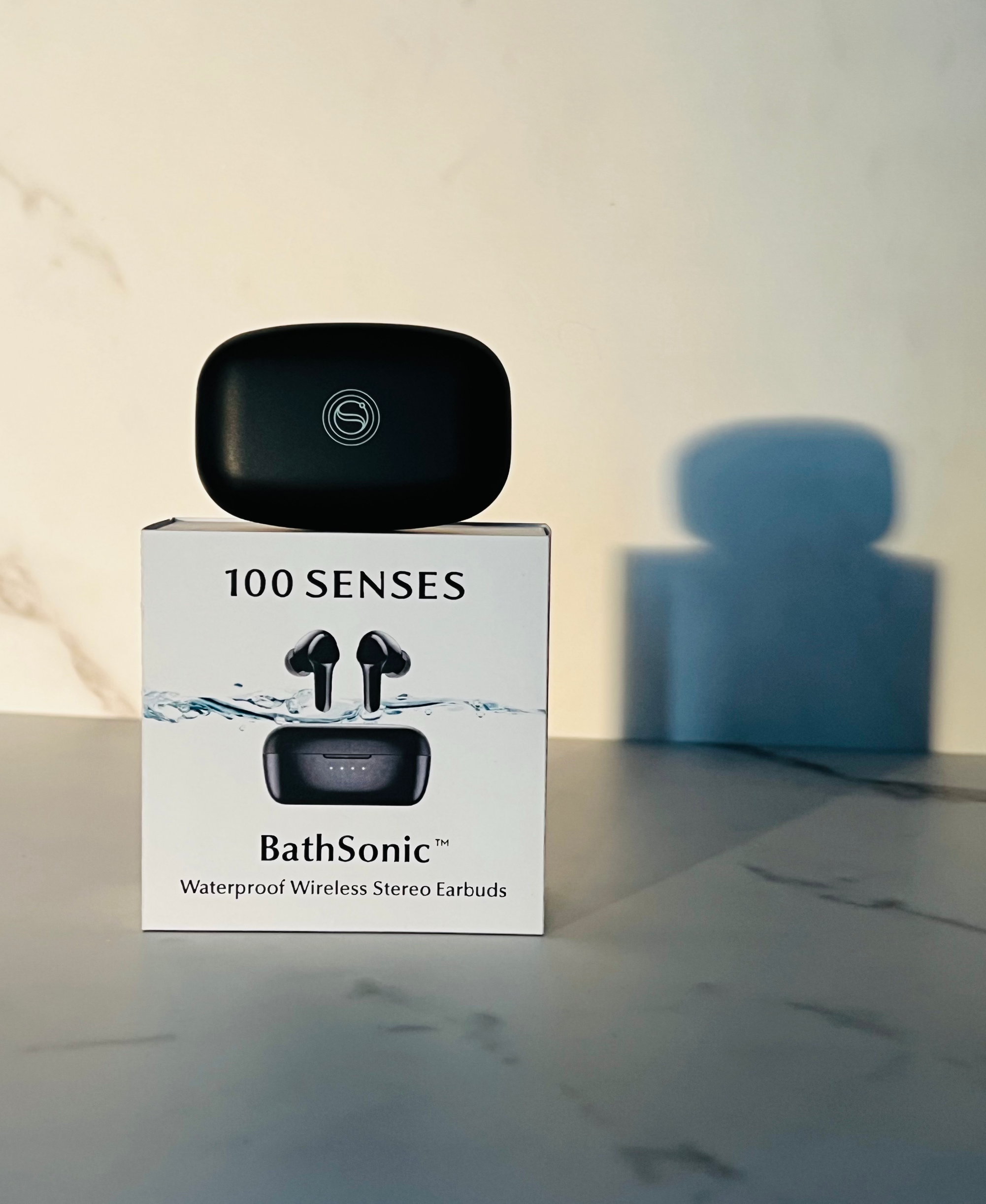 BathSonic waterproof wireless stereo earbuds charging case displayed on the product box.