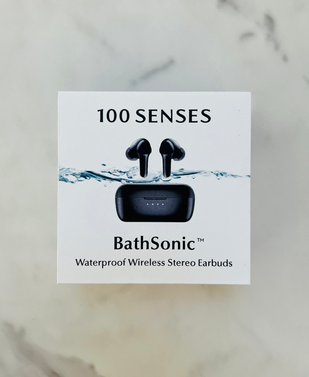 BathSonic waterproof earbuds and charging case pictured on product packaging.