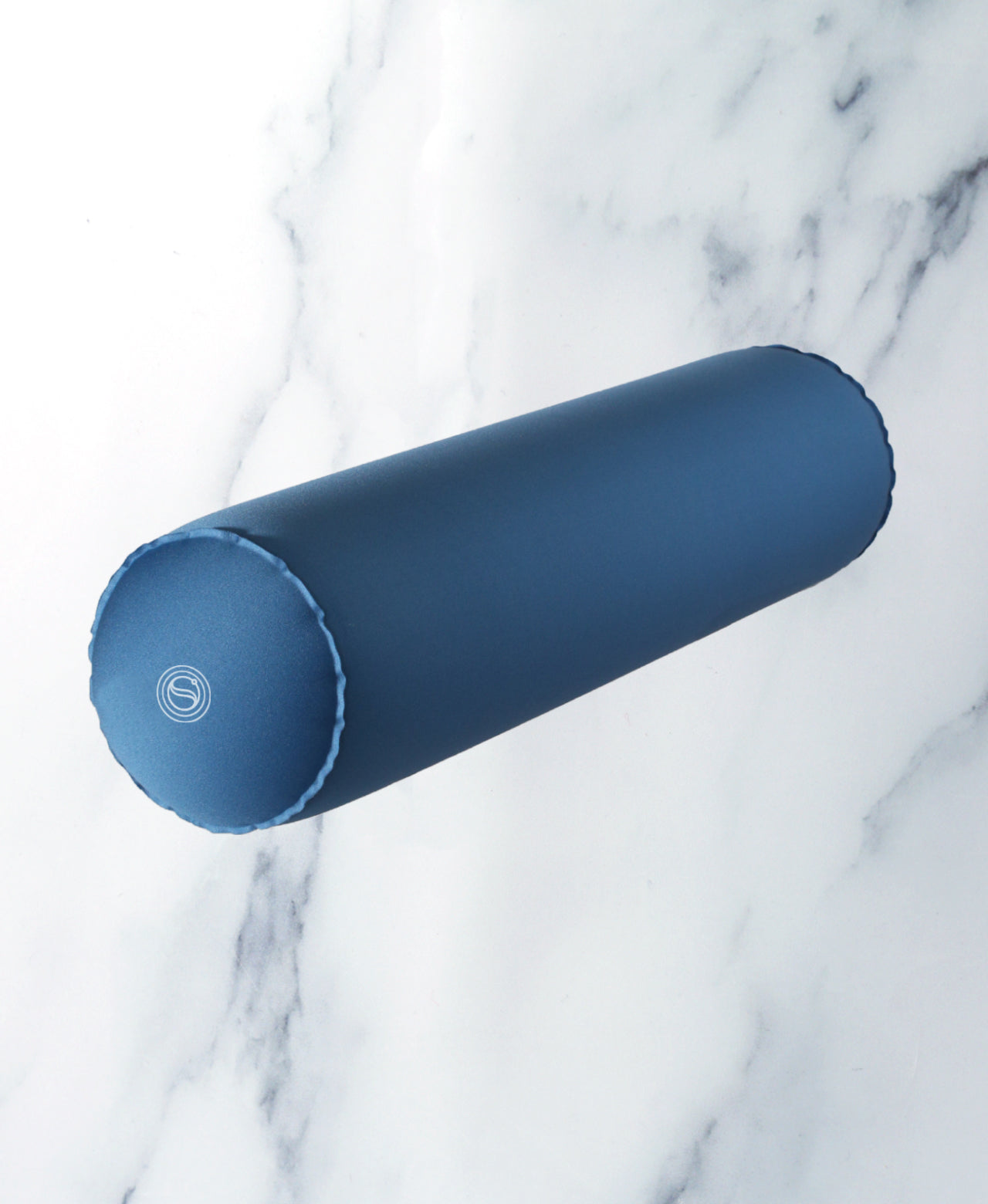 Blue cylindrical inflatable Body Floater on white marble.