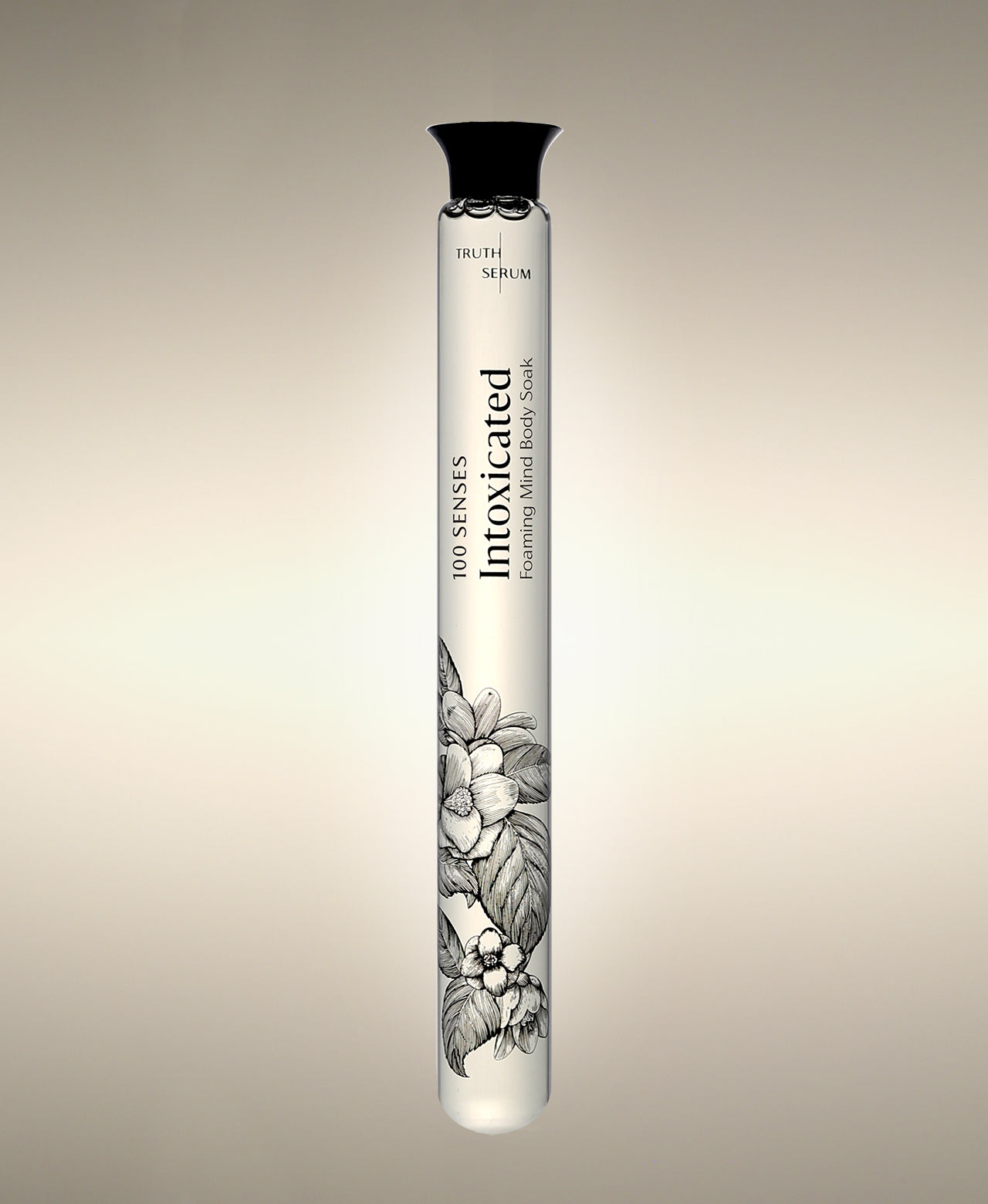 Intoxicated Foaming Bath Soak glass cylinder with a floral illustration, standing against a warm neutral background.