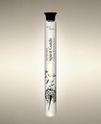 Spirit Guide Vetiver Agarwood glass Foaming Cylinder Soak with an illustration of dandelion seeds drifting from the seed head, standing against a warm neutral background.