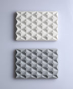 White and stone-gray 3D Pyramid Body Bar Rests with a faceted pyramid pattern.